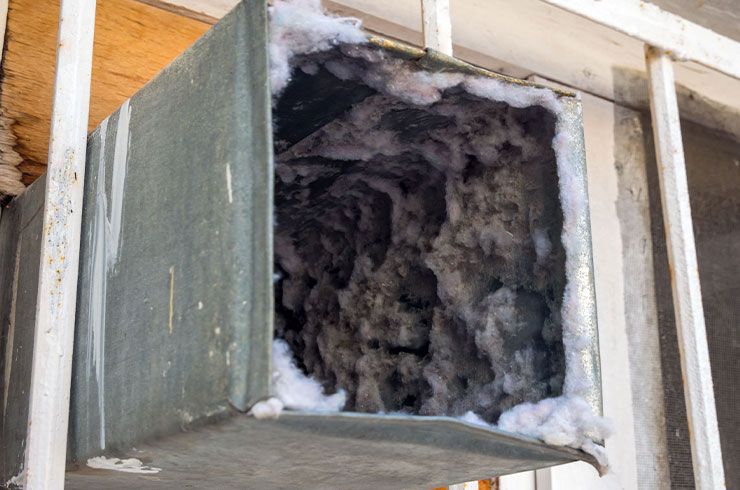 a dirty air duct filled with dust